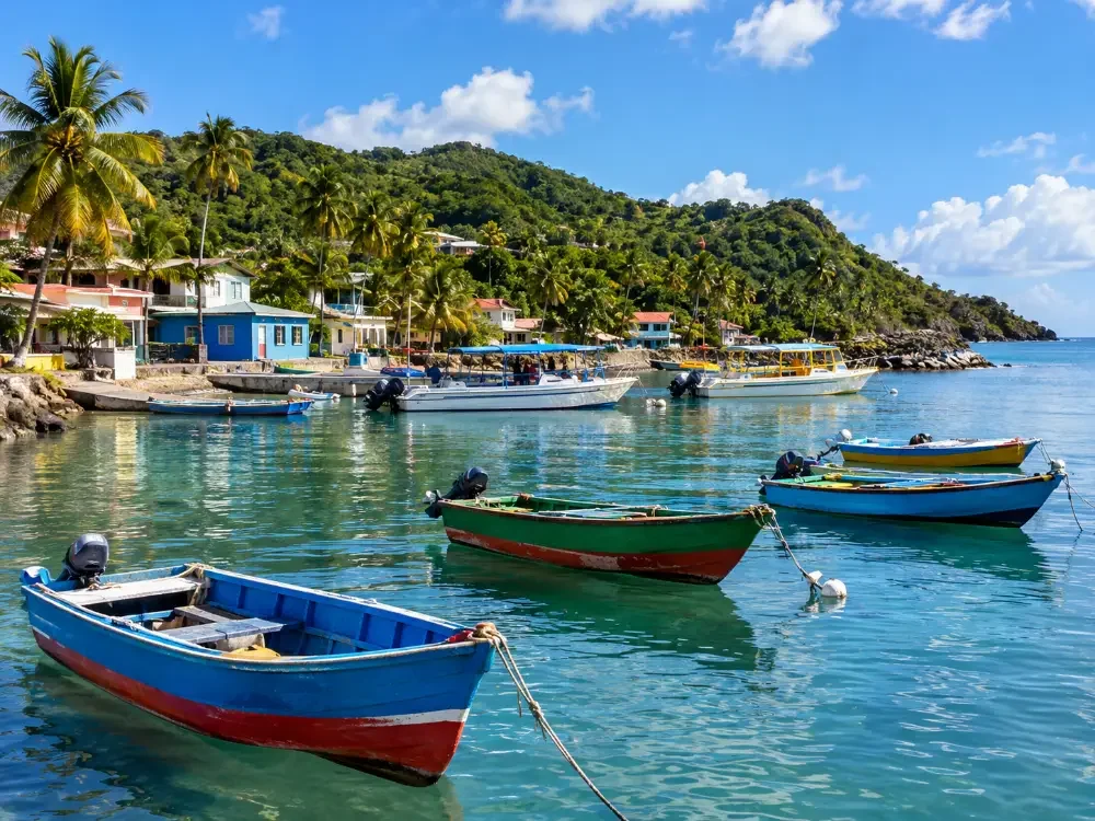 Small fishing boats and water taxis moored in a calm bay in Las Croabas
